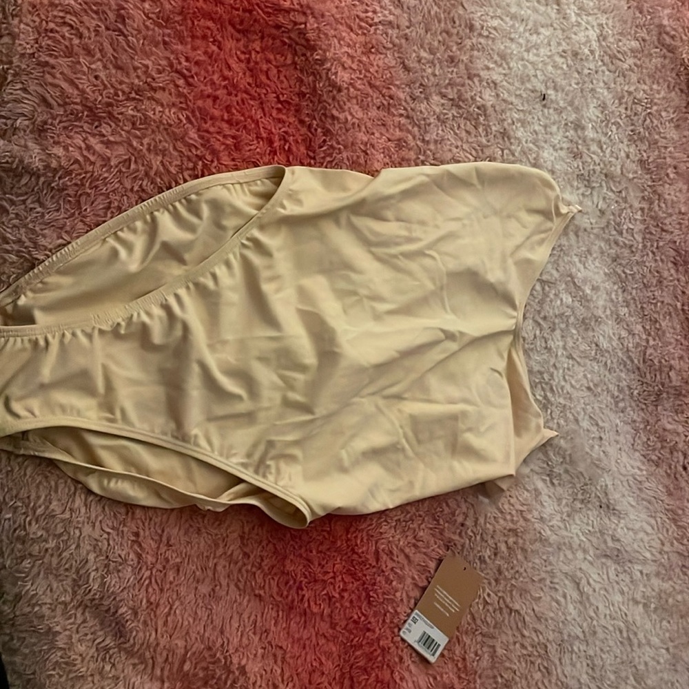 Capezio nude color bodysuit.